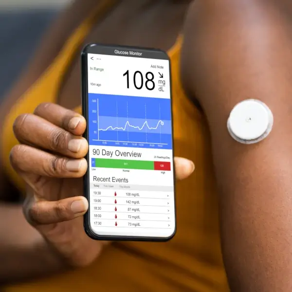 VitalWave Medical Supply Young Girl With Mom Reading Glucose Levels